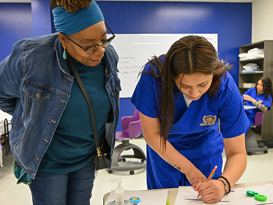  This is a photo of students at Fortis in a CNA class